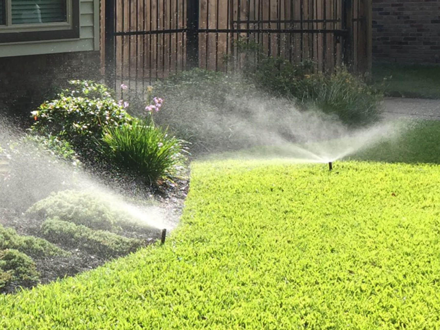 Irrigation sprinkler system watering a lawn